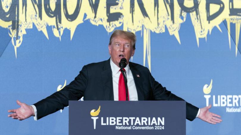 Donald Trump reacts during his address at the Libertarian National Convention in Washington. 