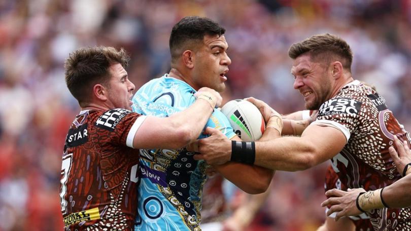 The Broncos struggled to contain barnstorming Titans forward David Fifita (centre).