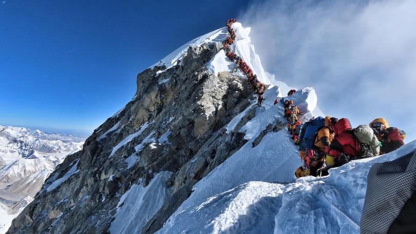 Look at all these people, lining up for hours to reach the summit, risking frostbite, altitude sickness and death. And for what, Kate Emery asks.