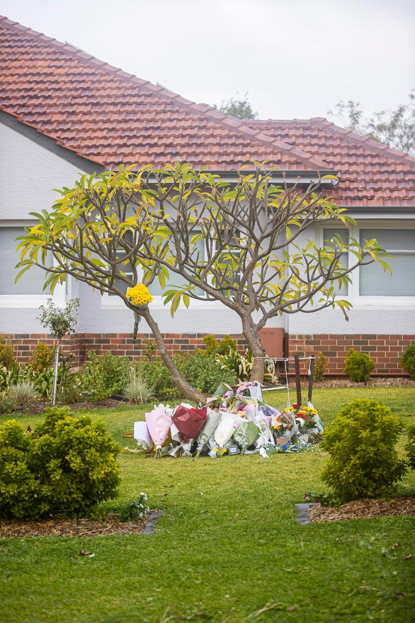 Pictured are flowers at a Floreat home, the scene of Friday's double murder and suicide. 