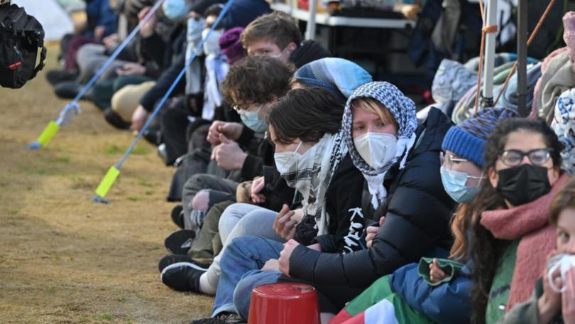 Students barricade the pro-Palestine protest camp at the Australian National University on Monday.