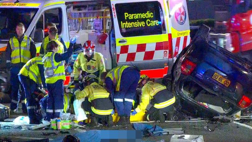 Emergency services treat patients at the scene of a motorbike accident in Greenacre.