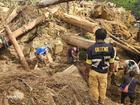 People continue to work at the scene of a deadly landslide in the province of Enga, 600 kilometres north-west of Port Moresby.