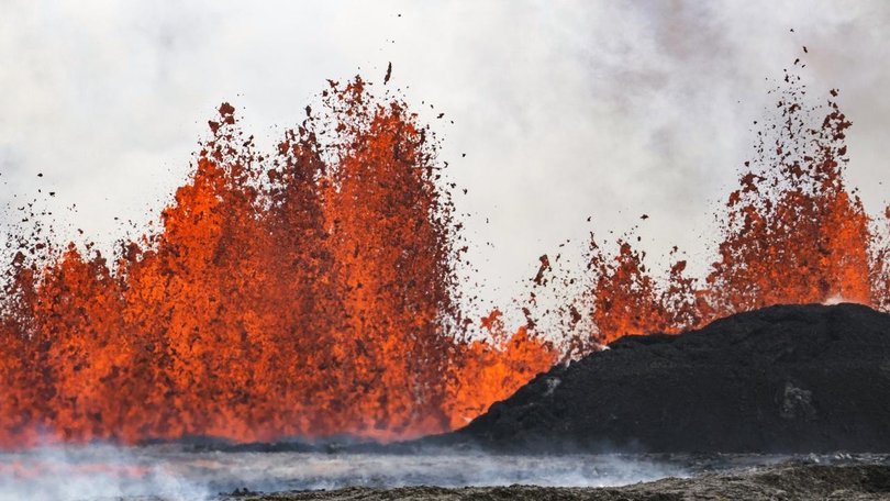 A volcano in southwestern Iceland spewing red streams of lava. (AP PHOTO)