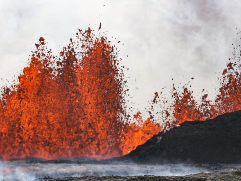 A volcano in southwestern Iceland spewing red streams of lava. (AP PHOTO)