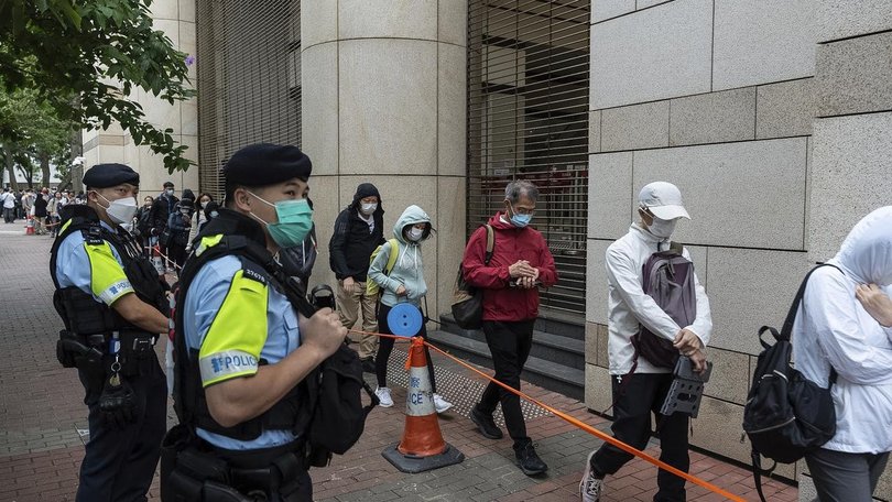 Security was tight around the Hong Kong court where democrats were found guilty in a landmark case.