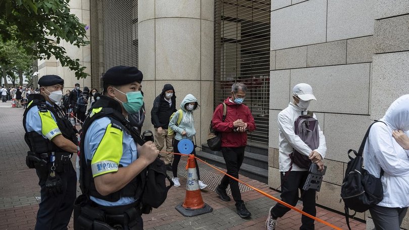 Security was tight around the Hong Kong court where democrats were found guilty in a landmark case. 