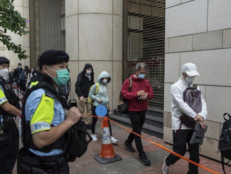 Security was tight around the Hong Kong court where democrats were found guilty in a landmark case. 