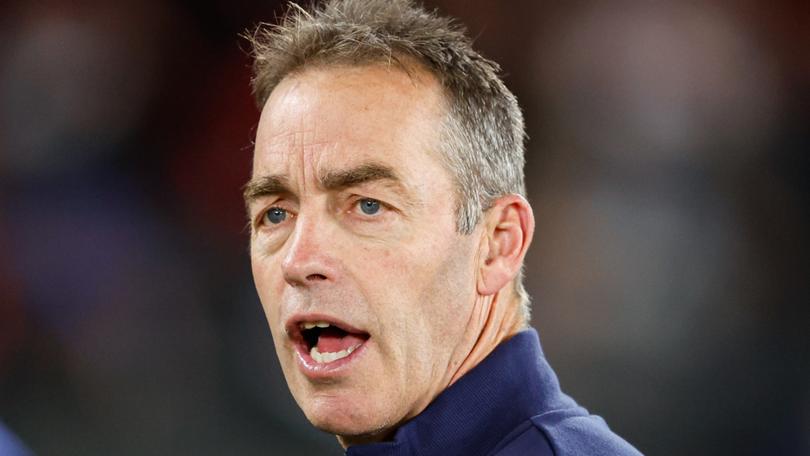 Alastair Clarkson has escaped punishment for swearing near the umpires bench during a game.