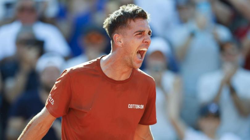 Thanasi Kokkinakis has won a classic from two sets down to make the third round at the French Open.