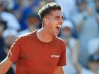 Thanasi Kokkinakis has won a classic from two sets down to make the third round at the French Open.