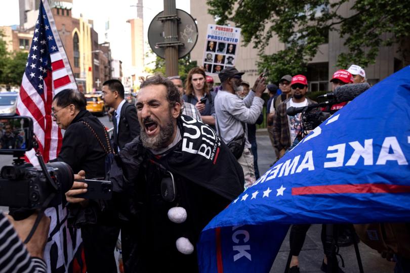 Supporters of former US President Donald Trump outside the Manhattan Criminal Courthouse in New York, US, on Thursday, May 30, 2024. A New York jury found Donald Trump guilty of multiple felonies at his hush-money trial, making him the first former US president to be convicted of crimes. Photographer: Yuki Iwamura/Bloomberg