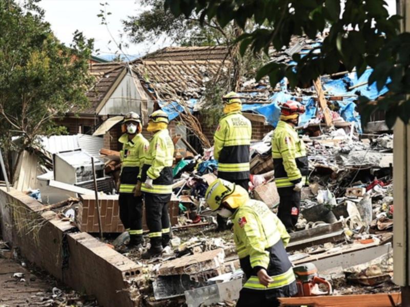 Fire Rescue personnel after the explosion of a townhouse