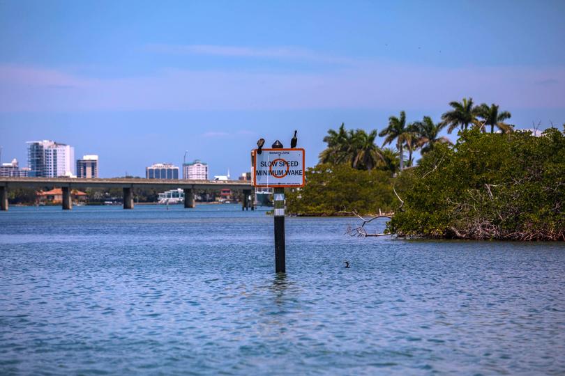 A sign warns boaters to slow down to protect ocean wildlife in Sarasota Bay in April.