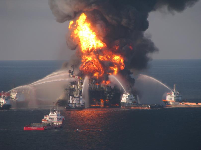 FILE - In this April 21, 2010 file image provided by the U.S. Coast Guard, fire boat response crews battle the blazing remnants of the off shore oil rig Deepwater Horizon. (AP Photo/US Coast Guard, File)