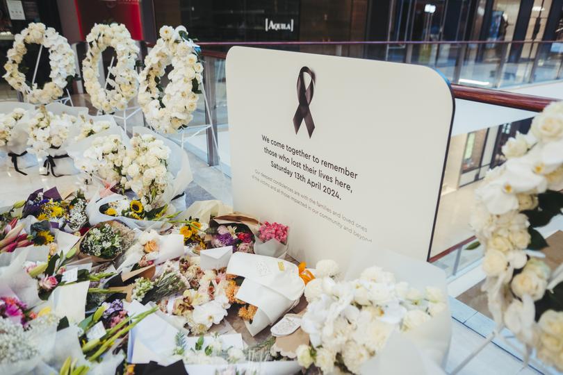 BONDI JUNCTION, AUSTRALIA - APRIL 18: Flowers and gifts are laid at the Westfield Bondi Junction shopping centre during a day of reflection on April 18, 2024 in Bondi Junction, Australia. The Westfield Bondi Junction shopping centre opened today for the community to reflect following a stabbing attack that killed seven, including the offender, on April 13, 2024. The shopping centre is not open for retail trade but is expected to re-open for business on April 19, 2024. (Photo by Dion Georgopoulos - Pool/Getty Images)