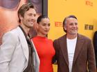 Richard Linklater, right, with Glen Powell and Adria Arjona at the Netflix premiere of Hit Man.

