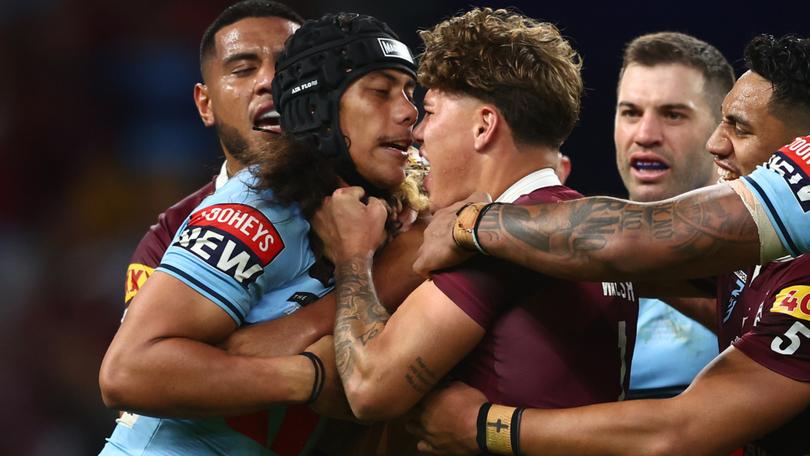 Jarome Luai of the Blues and Reece Walsh of the Maroons scuffle during game two of the State of Origin series last year.