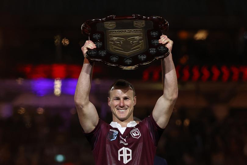Daly Cherry-Evans holds aloft the State of Origin Shield last year.