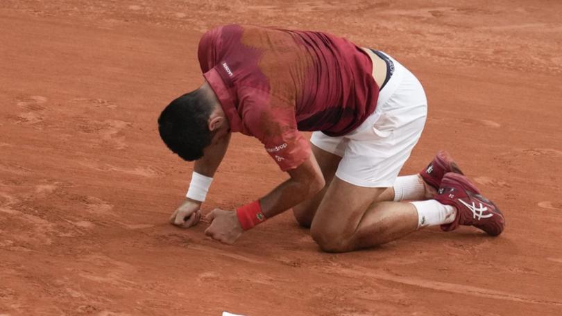 Novak Djokovic is out of the French Open after injuring his knee during his last-16 match. (AP PHOTO)