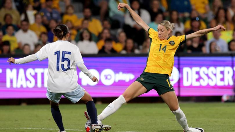 Alanna Kennedy (r) says the Matildas are tired of finishing outside the prizes at big tournaments.