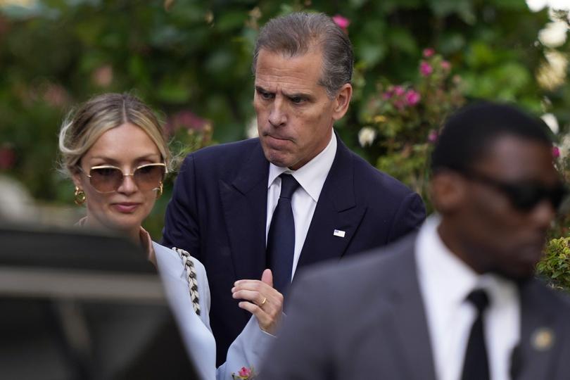 Hunter Biden, center, accompanied by his wife Melissa Cohen Biden, left, departs from federal court, Tuesday, June 4, 2024, in Wilmington, Del. (AP Photo/Matt Slocum)