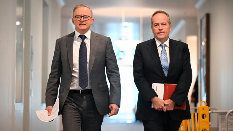 Australian Prime Minister Anthony Albanese (left) and Australian Minister for Government Services Bill Shorten arrive to speak to media during a press conference at Parliament House in Canberra, Friday, July 7, 2023. (AAP Image/Lukas Coch) NO ARCHIVING