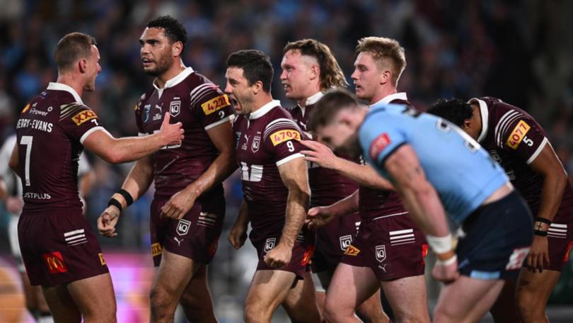 Ben Hunt (c) is congratulated by skipper Daly Cherry-Evans after scoring a try in the 38-10 win. (Dan Himbrechts/AAP PHOTOS)