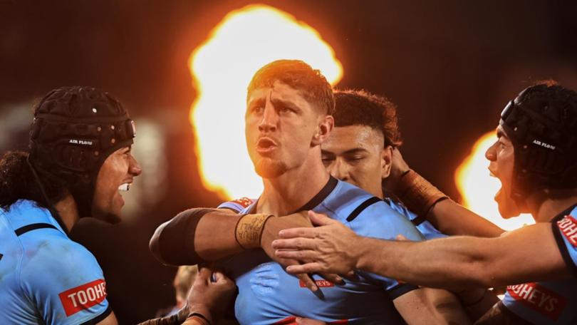 NSW debutant Zac Lomax (c) was the Blues' best player and also scored a brilliant try. (Mark Evans/AAP PHOTOS)