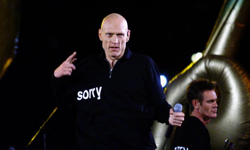 PETER GARRETT FROM MIDNIGHT OIL PERFORMING AT THE CLOSING CEREMONY OF THE SYDNEY OLYMPIC GAMES.