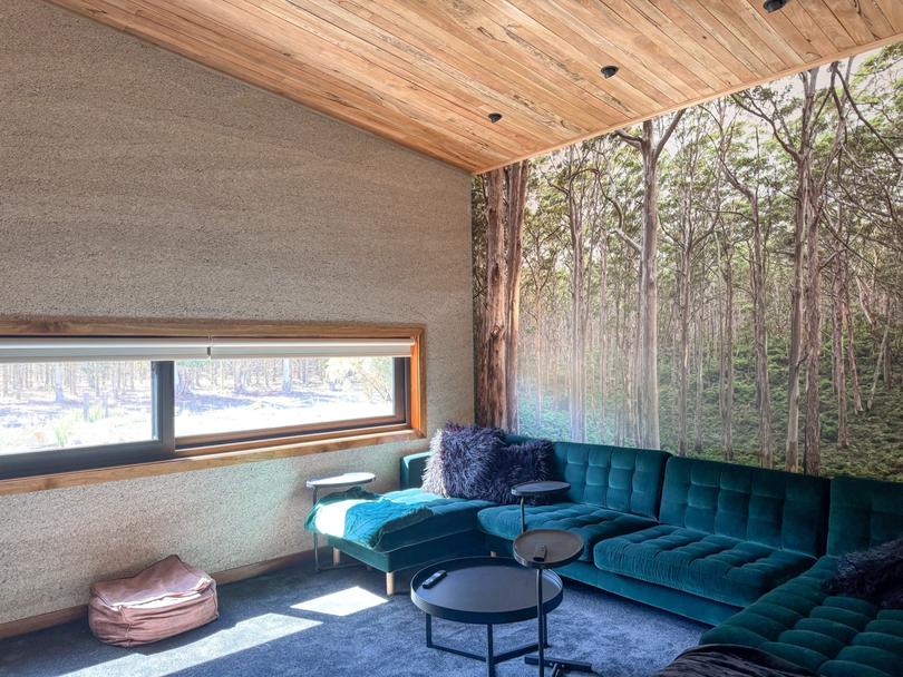 The home cinema features wallpaper with karri trees from the local Boranup Forest.