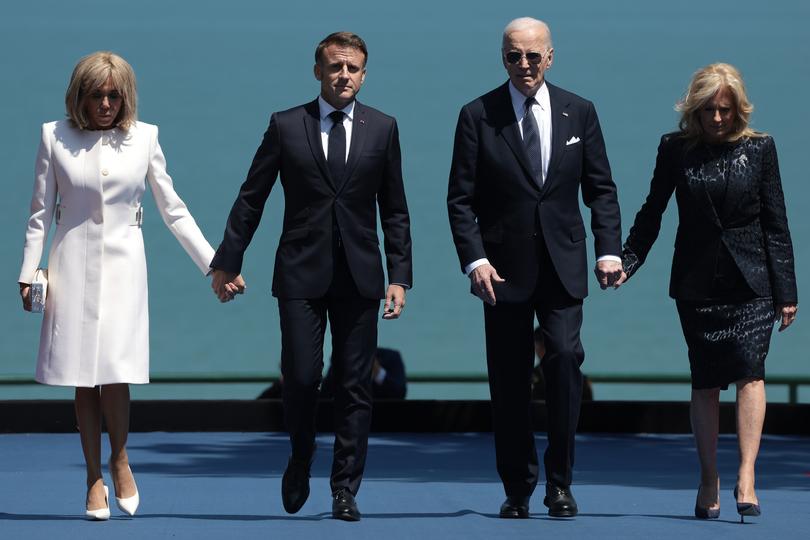 COLLEVILLE-SUR-MER, FRANCE - JUNE 06: U.S. President Joe Biden (2nd R) and (L-R) Brigitte Macron, French President Emmanuel Macron, and U.S. first lady Jill Biden arrive at a ceremony at the Normandy American Cemetery on the 80th anniversary of D-Day on June 06, 2024 in Colleville-sur-Mer, France. Veterans, families, political leaders and military personnel are gathering in Normandy to commemorate D-Day, which paved the way for the Allied victory over Germany in World War II. (Photo by Win McNamee/Getty Images) *** BESTPIX ***