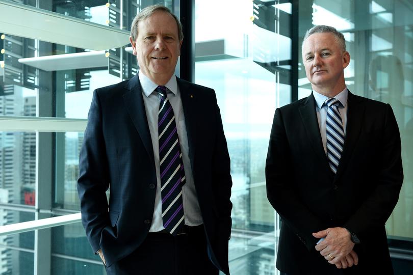 Nine Entertainment Chairman Peter Costello, (left), and CEO Hugh Marks pose for photographs after the company's annual general meeting in Sydney, Tuesday, Nov. 15, 2016. The broadcaster is forecasting continuing pressure in the advertising market, with its metro free-to-air advertising revenue expected to fall in 2017. (AAP Image/Dan Himbrechts) NO ARCHIVING