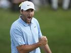 Scottie Scheffler lets out some emotion after sealing victory on the 18th green in Ohio.