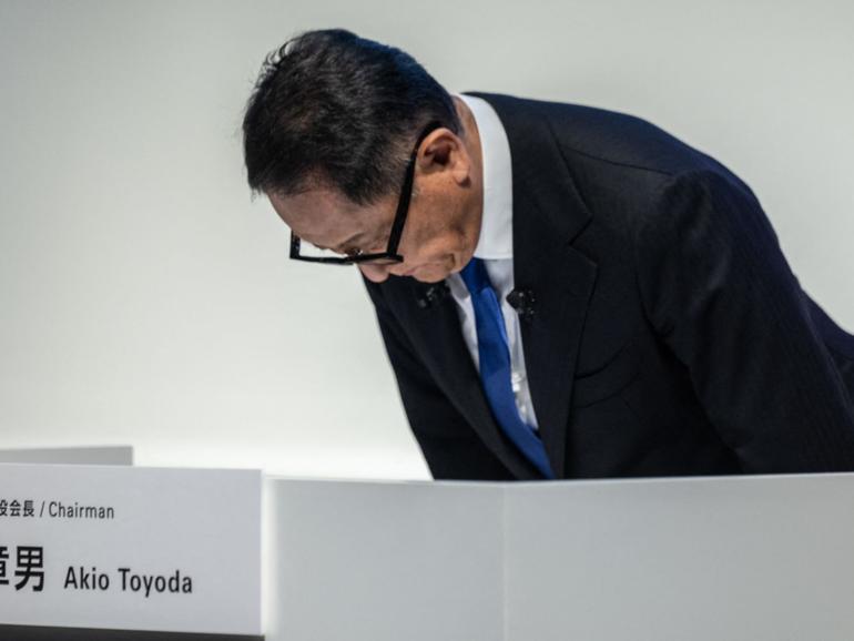 Toyota Motor Corporation Board Chairman Akio Toyoda bows during a press conference in Tokyo on June 3, 2024. Toyota said on June 3 it had suspended domestic shipments of three car models after falling foul of government certification rules along with its Japanese rivals Honda, Mazda, Suzuki and Yamaha.