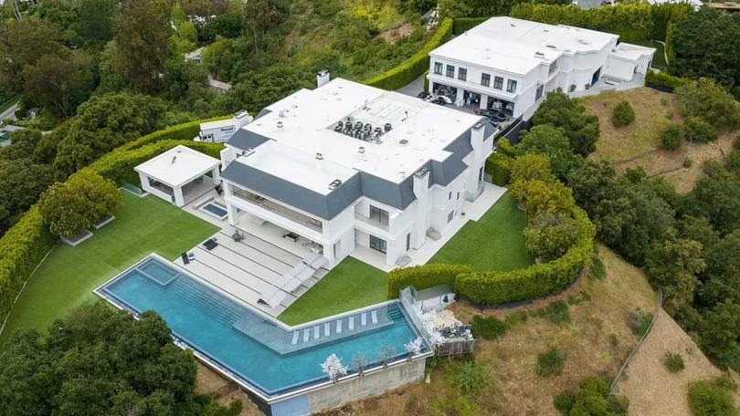Fifty images of the palatial $60 million property are lit up and glowing against the Los Angeles sky are visible across multiple real estate sites where once there were none.