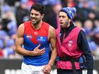 Christian Petracca tried to play on after suffering a rib injury, but eventually left the field.  (James Ross/AAP PHOTOS)