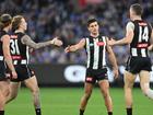 Magpie Nick Daicos (second right) kicked a goal but was injured late in the win over the Demons. (James Ross/AAP PHOTOS)