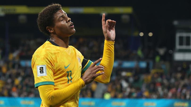 Kusini Yengi of the Socceroos dances after scoring a goal.