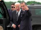 President Joe Biden talks with his son Hunter Biden as he arrives at Delaware Air National Guard Base.