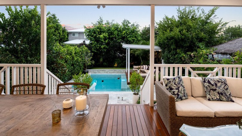 Taking in the view of the pool and gardens.