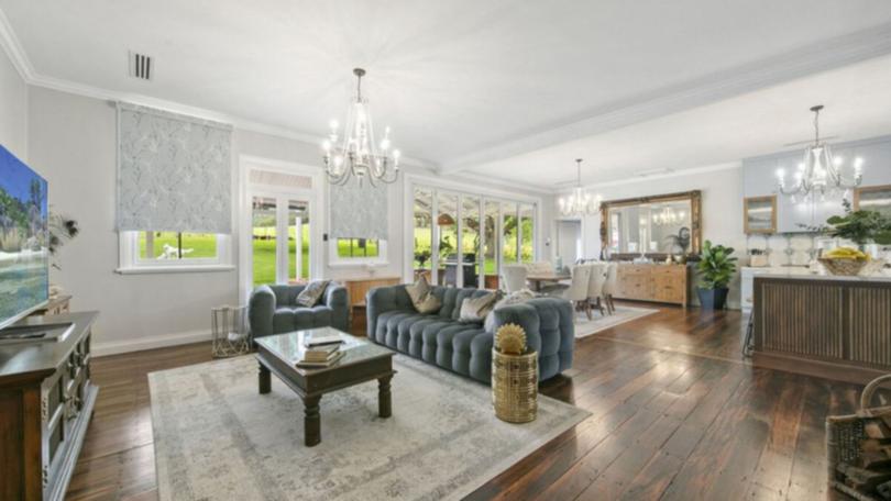 The new kitchen has fluted oak cabinetry, blue shaker doors, a 900mm cooker and an adjoining butler's pantry.