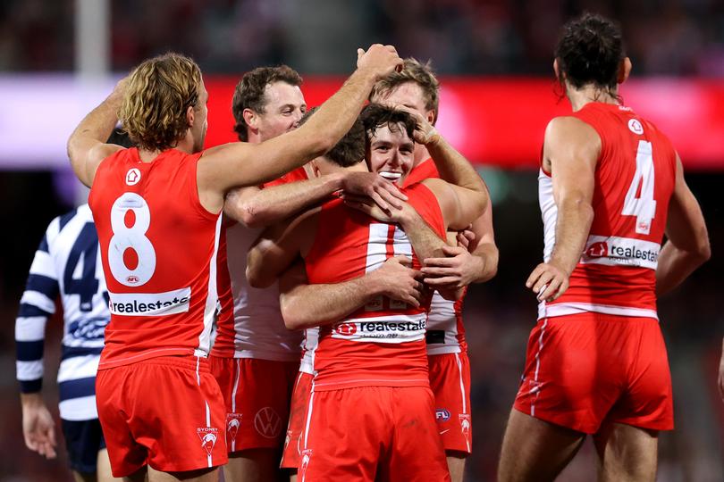 SYDNEY, AUSTRALIA - JUNE 09: Errol Gulden of the Swans celebrates kicking a goal with team mates during the round 13 AFL match between Sydney Swans and Geelong Cats at SCG, on June 09, 2024, in Sydney, Australia. (Photo by Brendon Thorne/AFL Photos/via Getty Images)