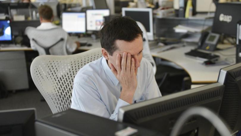 A union wants changes to the Fair Work Act due to the amount of unpaid overtime people endure. (Tracey Nearmy/AAP PHOTOS)