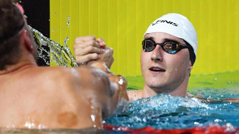 Cameron McEvoy is congratulated after winning the final of the men's 50m freestyle.