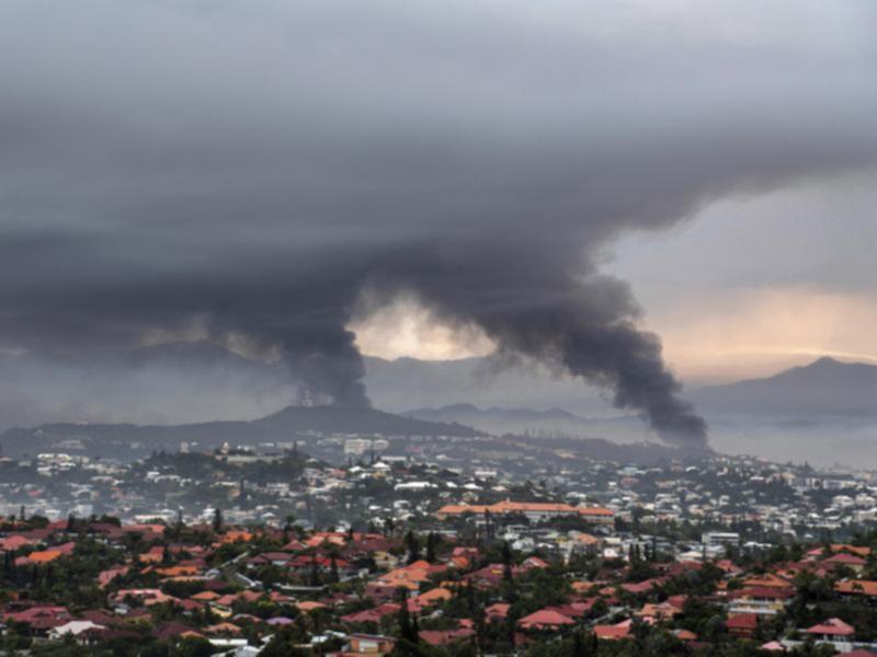 Smoke rises during protests in Noumea, New Caledonia