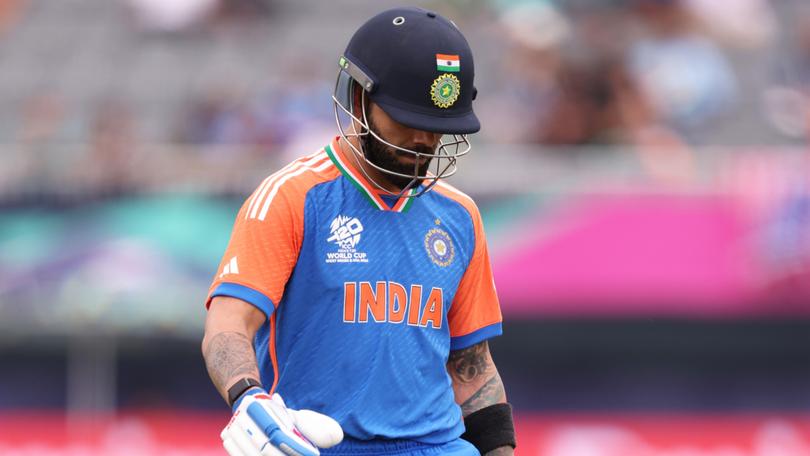 Virat Kohli of India makes his way off after being dismissed by the USA for a duck overnight.