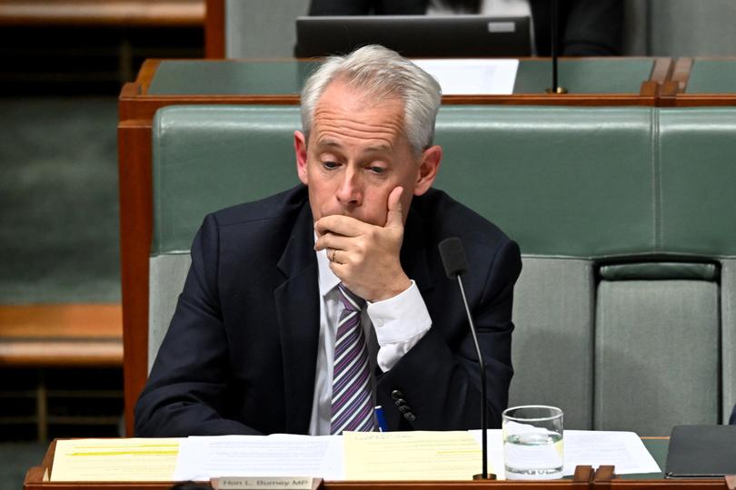 Australian Immigration Minister Andrew Giles reacts during Question Time at Parliament House in Canberra, Wednesday, May 29, 2024. (AAP Image/Lukas Coch) NO ARCHIVING