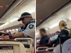 A man has been arrested and marched off a Virgin Australia flight at Melbourne Airport.