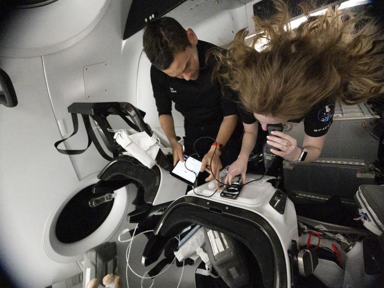 In an image provided by the company, Jared Isaacman, left, and Hayley Arceneaux, participate in SpaceXs Inspiration4 mission in September 2021. The Inspiration4 crew, who spent only three days off Earth, experienced physical and mental changes that included modest declines in cognitive tests, stressed immune systems and genetic changes within their cells. 